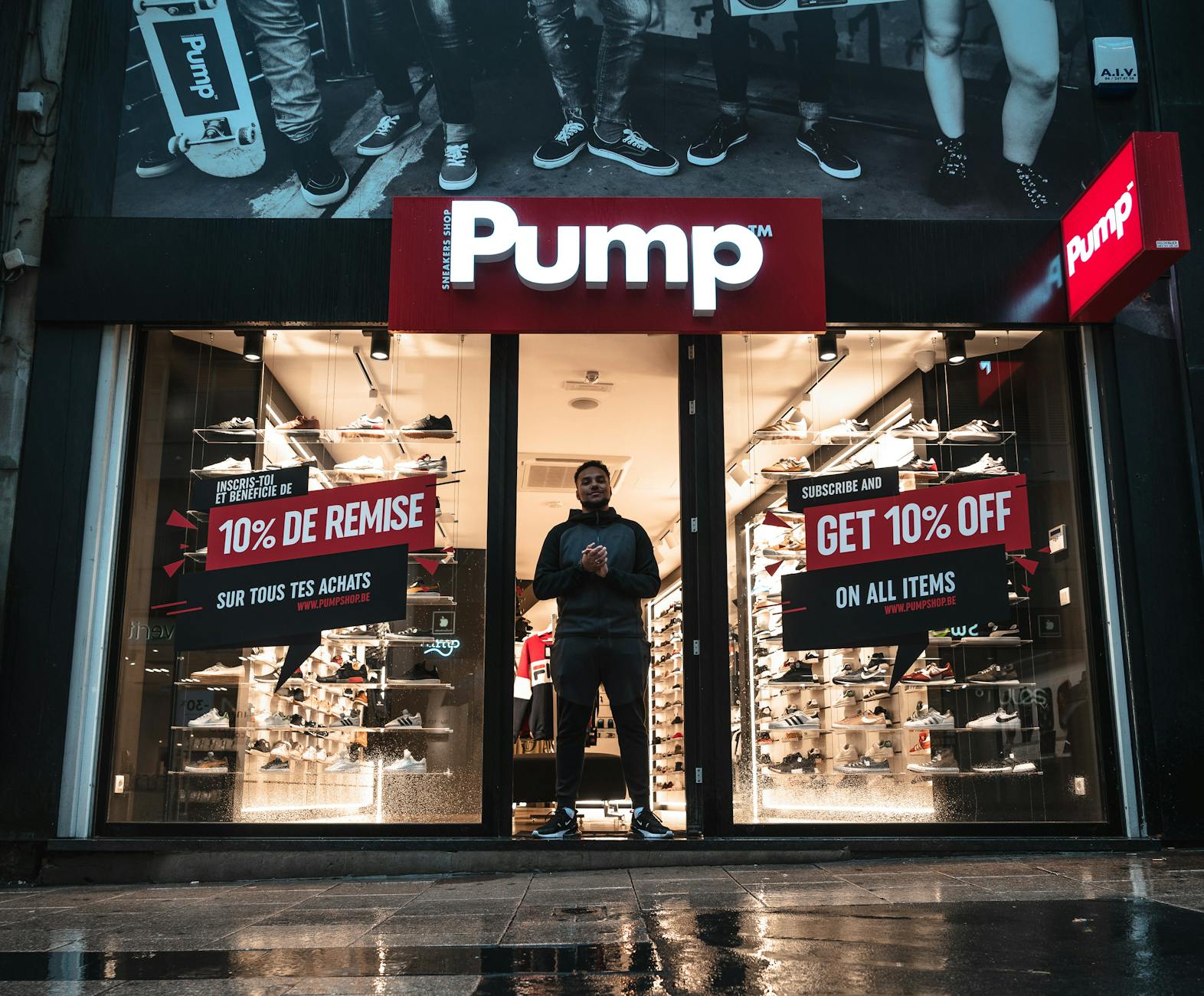man standing at the doorway of pump shop
